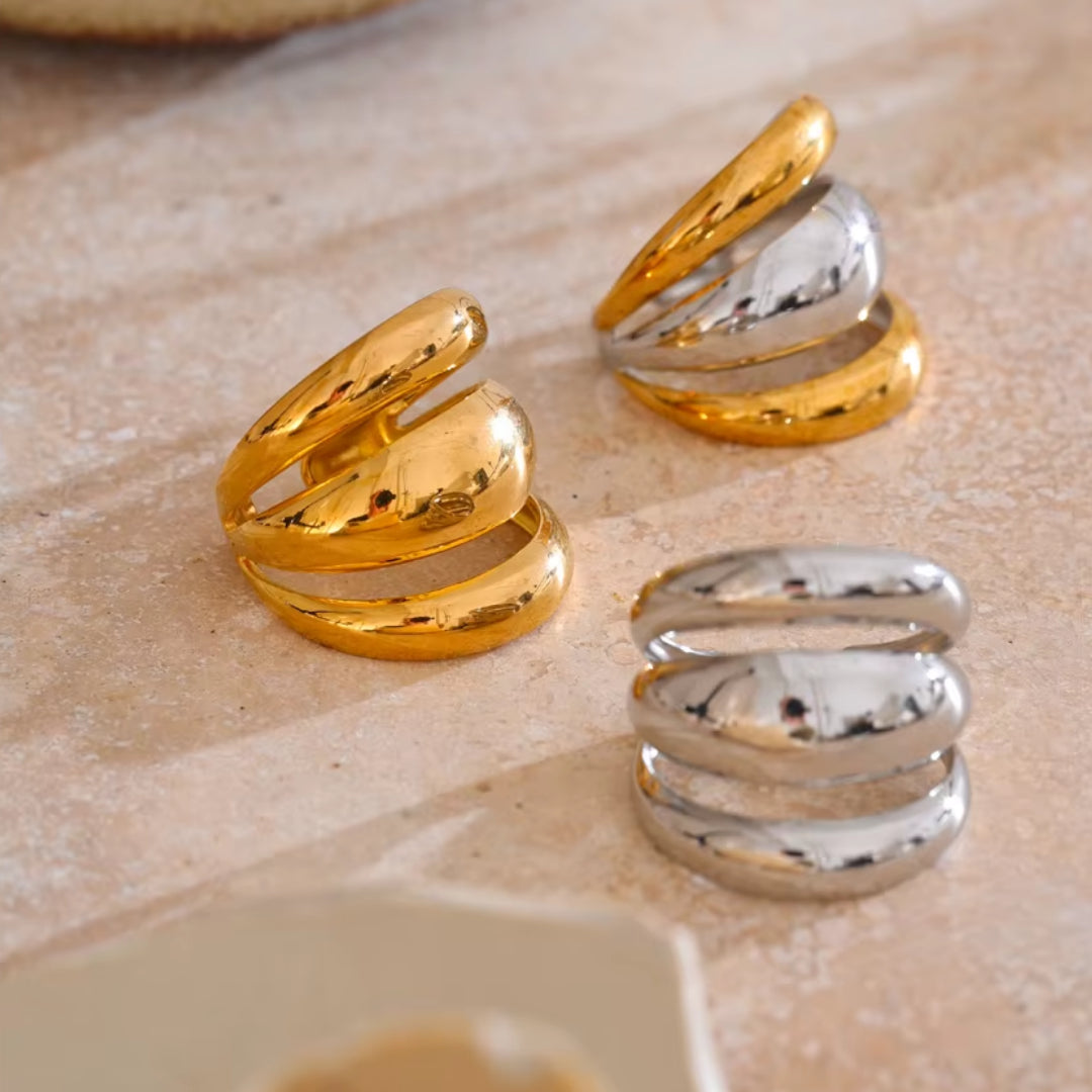 Joya geométrica en acero inoxidable dorado – lenorajewelry.com/anillo-geometrico-capas-doradas
anillo geométrico, joyería de acero inoxidable, anillo dorado para mujer, joyas modernas, regalo elegante, lenora joyas, diseño ajustable, envío rápido, oro PVD, accesorio único