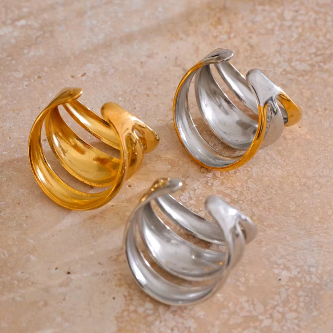 Joya geométrica en acero inoxidable dorado – lenorajewelry.com/anillo-geometrico-capas-doradas
anillo geométrico, joyería de acero inoxidable, anillo dorado para mujer, joyas modernas, regalo elegante, lenora joyas, diseño ajustable, envío rápido, oro PVD, accesorio único