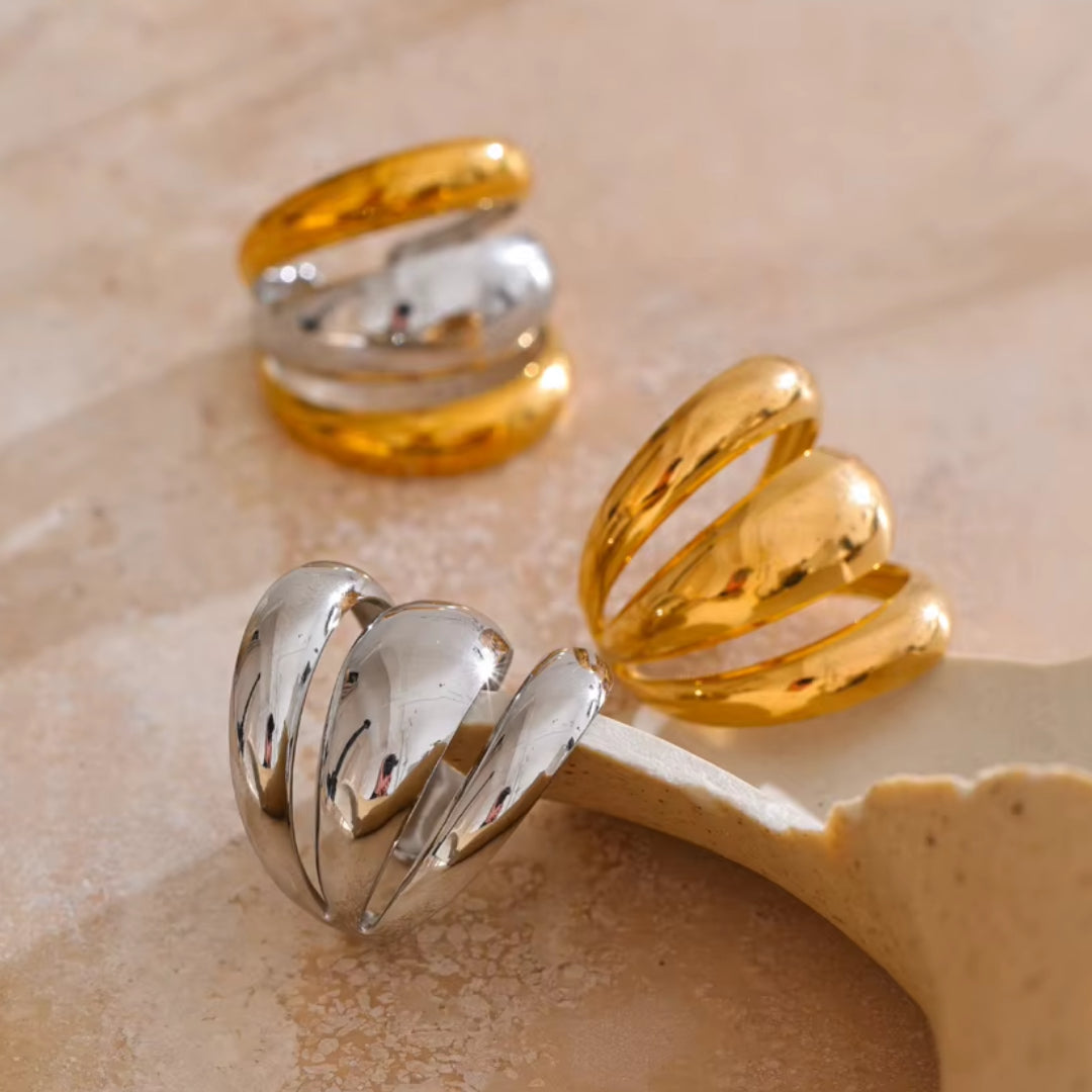 Joya geométrica en acero inoxidable dorado – lenorajewelry.com/anillo-geometrico-capas-doradas
anillo geométrico, joyería de acero inoxidable, anillo dorado para mujer, joyas modernas, regalo elegante, lenora joyas, diseño ajustable, envío rápido, oro PVD, accesorio único