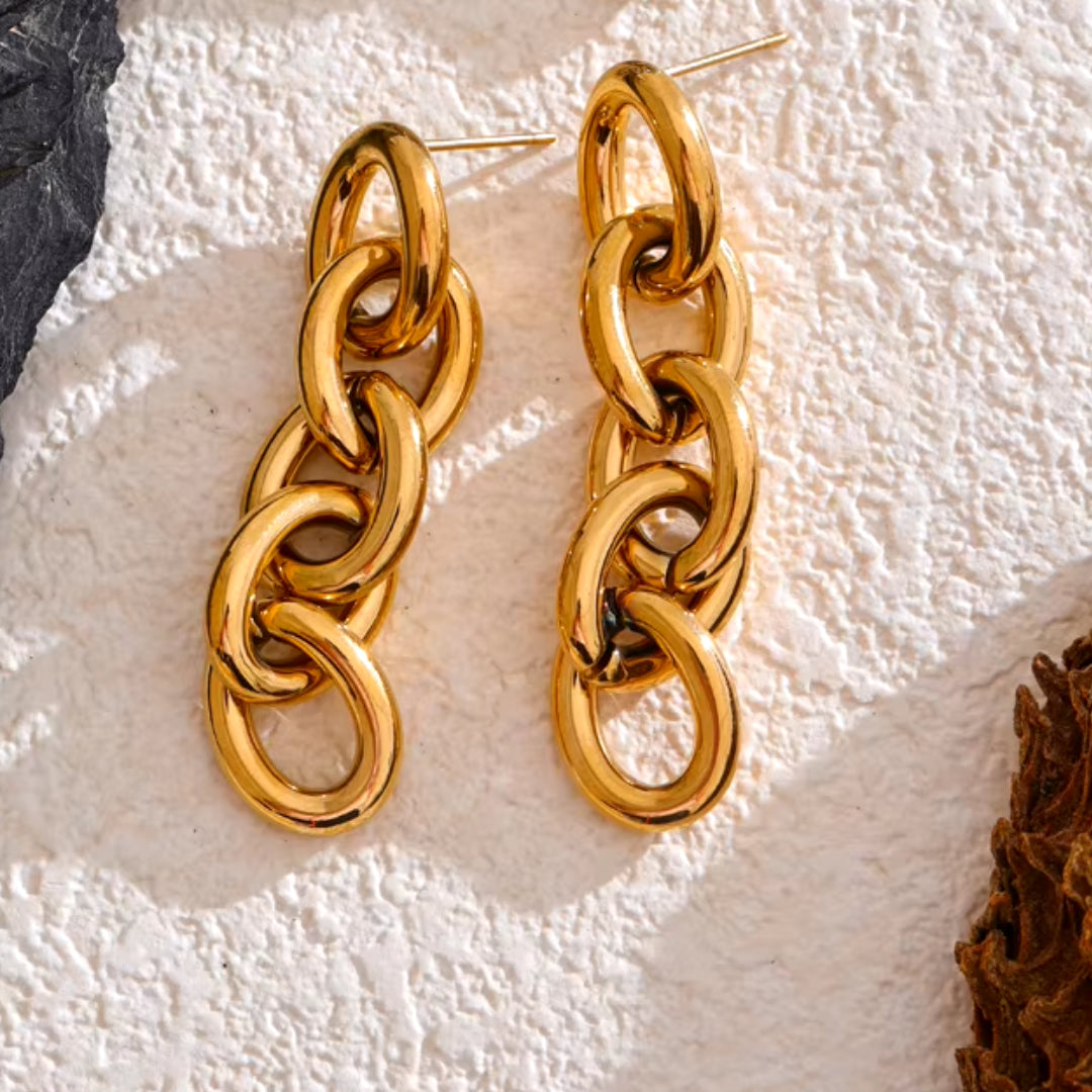 aretes colgantes, acero inoxidable, oro 18K, resistentes al agua, joyería moderna, elegancia