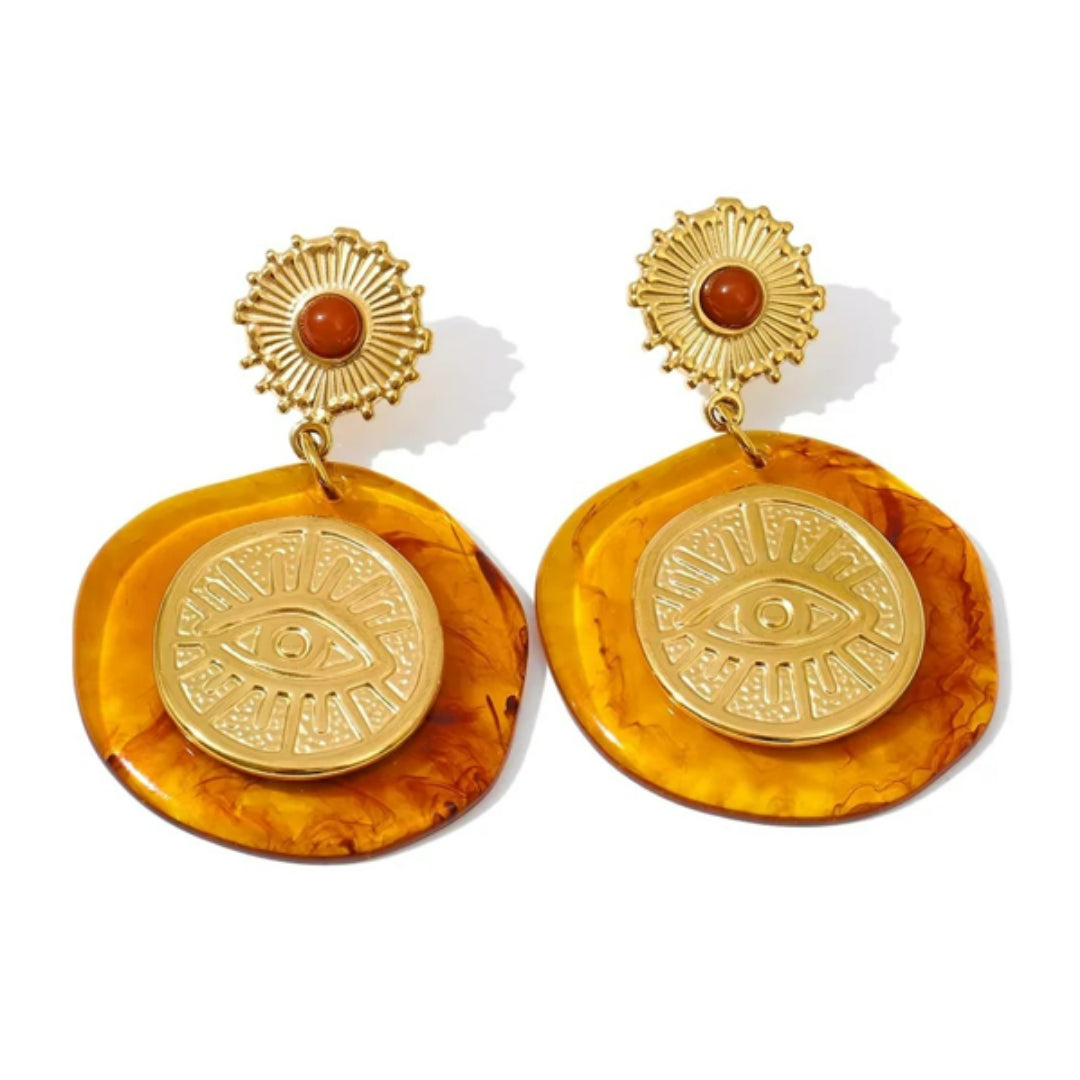 Aretes Girasol Lux en resina floral – lenorajewelry.com/aretes-girasol-lux, aretes florales, aretes de resina, aretes colgantes mujer, aretes dorados modernos, joyería con flores, aretes de lujo lenora, accesorios otoño invierno, aretes resistentes al agua, pendientes grandes, aretes llamativos