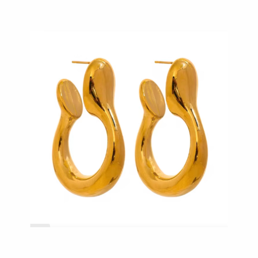 https://lenorajewelry.com/aretes-geometricos-dorados-acero-inoxidablearetes geométricos, pendientes dorados, aretes de acero inoxidable, joyería moderna, pendientes elegantes, joyería de alta calidad, moda minimalista, aretes únicos, accesorios dorados