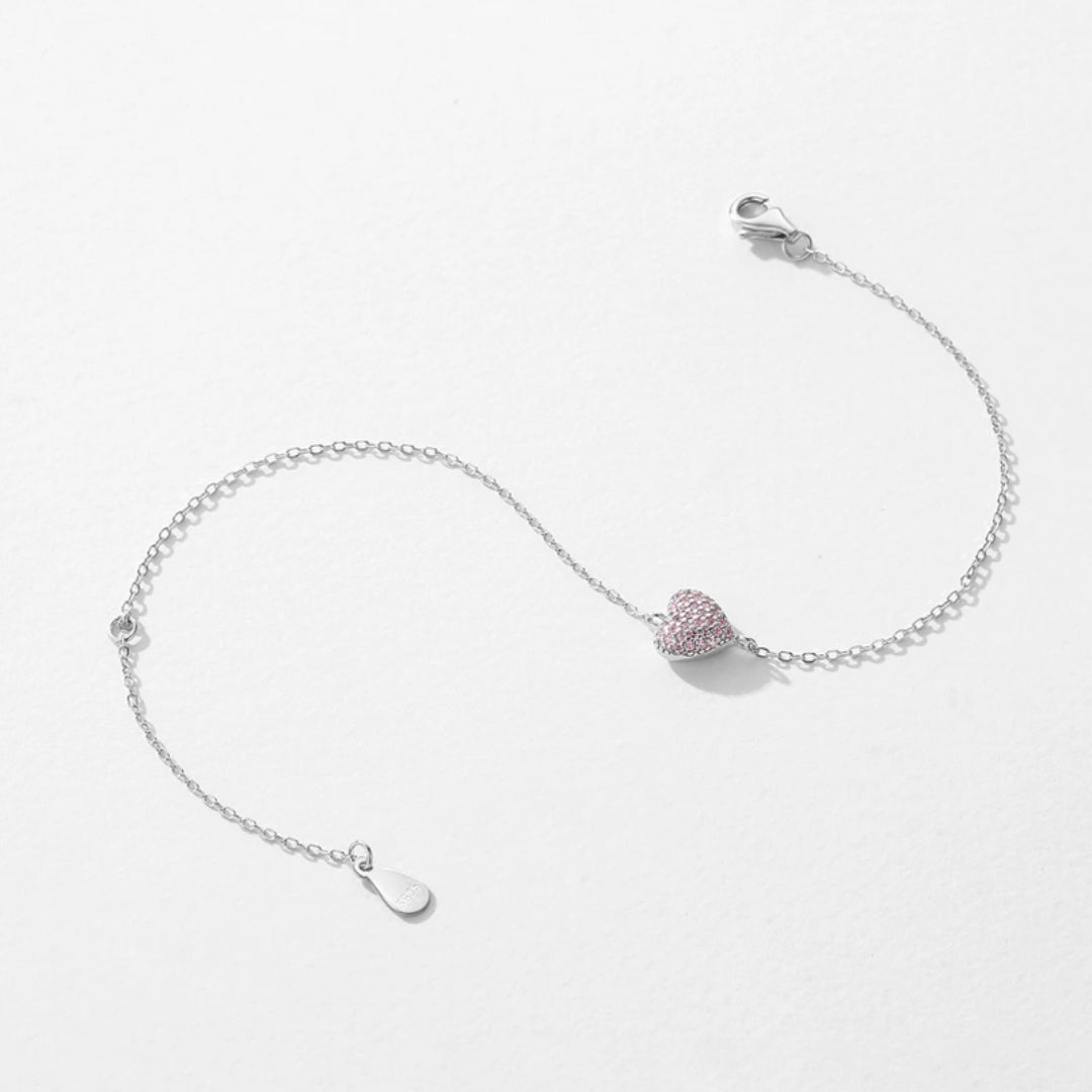 pulsera ajustable con corazón, pulsera de circonia rosa, pulsera ajustable de circonia, pulsera con corazón de circonia, joyería con circonia rosa, pulsera elegante con corazón, pulsera de moda ajustable, pulsera con piedra rosa, joyería de calidad, pulsera de diseño con circonia, accesorio ajustable, pulsera de amor, pulsera de corazón elegante